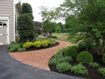 Brick Sidewalk and Oval Planting Beds